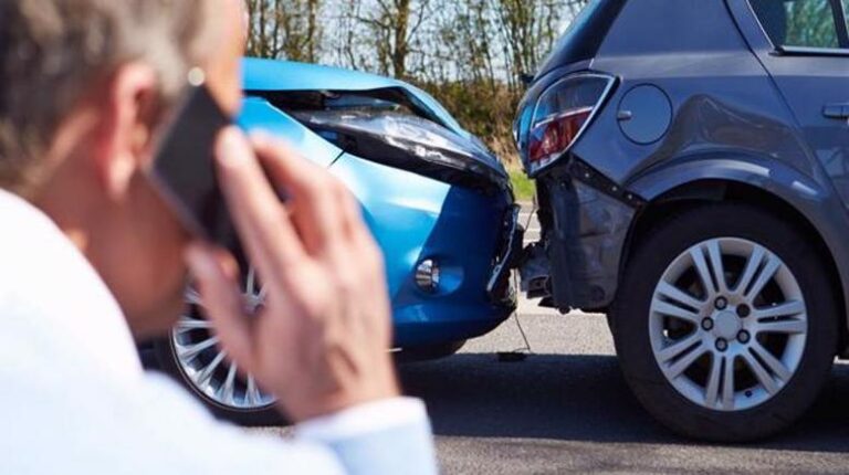 Man calling car accident lawyer after wreck, liability for accident