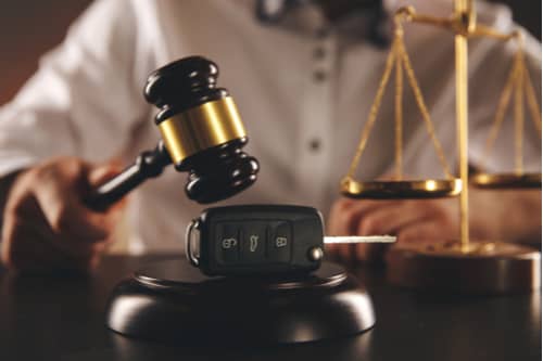 Judge gavel and car keys Apple Valley car accident lawyer concept