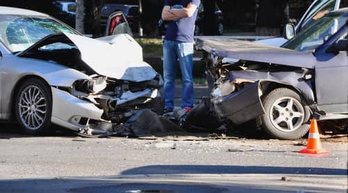cars severely damaged in frontal collision Palmdale car accident lawyer concept