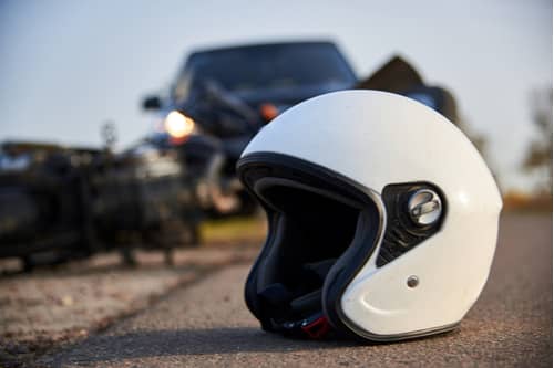 Motorcycle helmet on road after accident, Victorville motorcycle accident lawyer concept