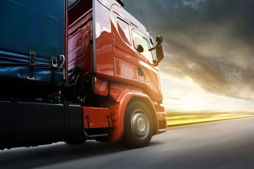 Truck driving down a highway concept of Fullerton truck accident lawyer