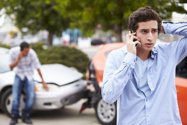man making phone call to start car accident claim