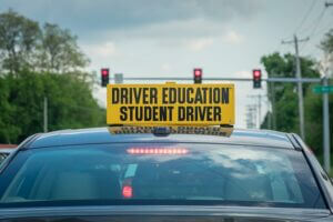 A driving school car, student driver crash concept