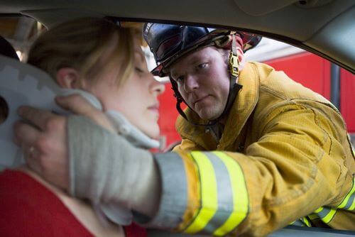 a rescuer is providing assistance to a woman