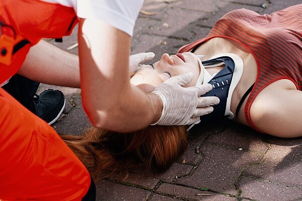 A medic is providing first aid after an accident