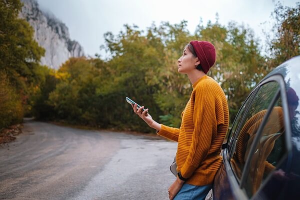 Photo of a person holding a phone in their hand