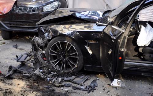 Two cars heavily damaged from a head-on accident.