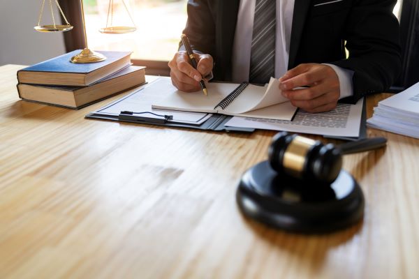 Lawyer taking notes in a notebook