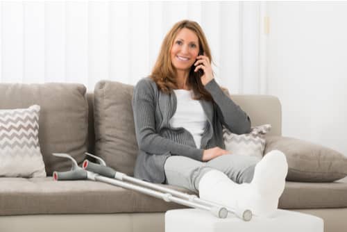 Woman with broken leg calling Hesperia personal injury lawyer