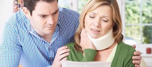 A woman reviewing a settlement offer after suffering a eprsonal injury in Huntington Beach, CA.