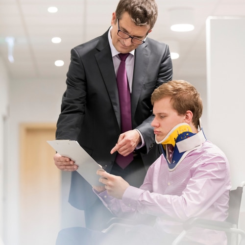 This image shows an Indio car accident lawyer speaking with an injured victim.