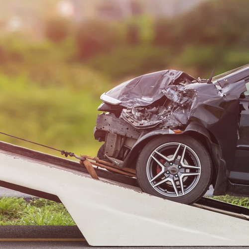 This is an image of a damaged front end of car following a car accident in Indian Wells California